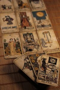 vintage tarot cards spread on bamboo mat